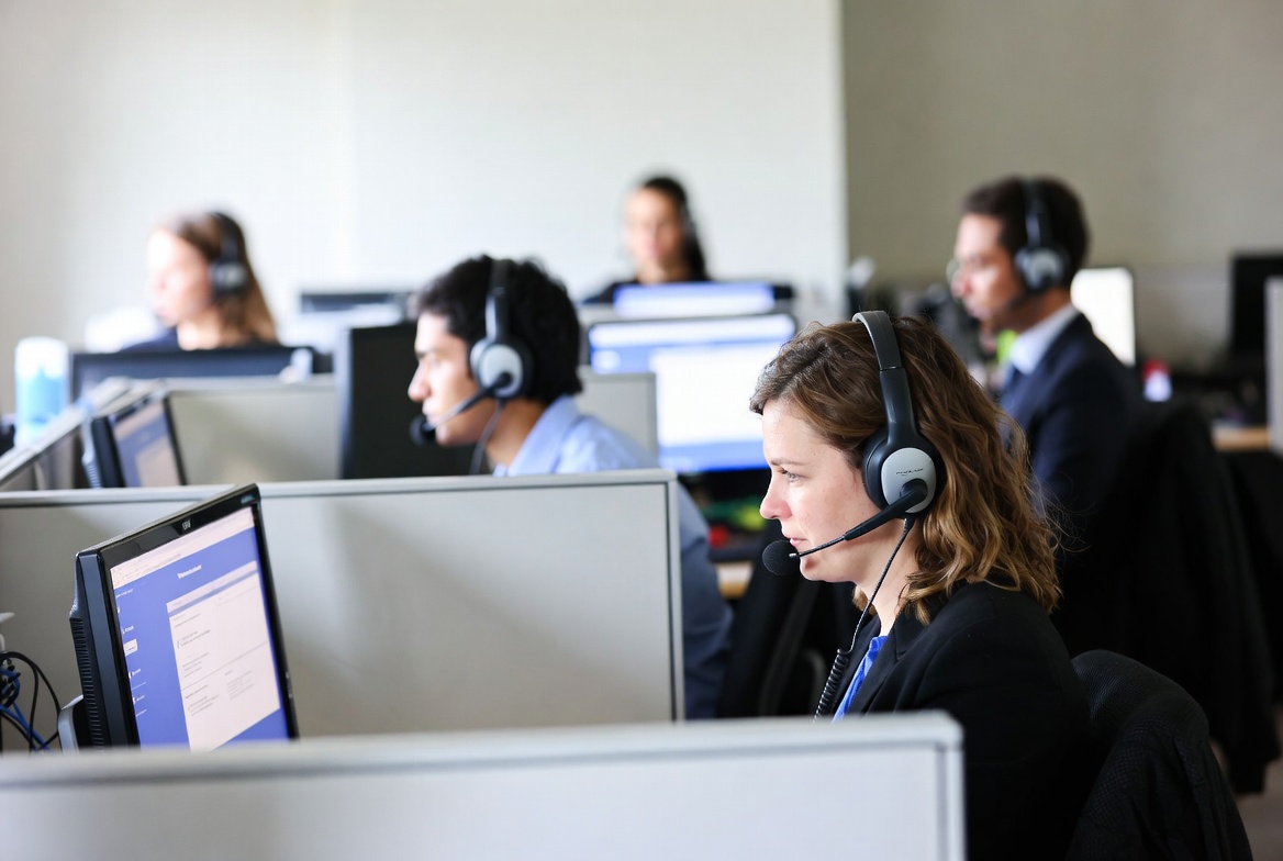 Call center customer service agents working in a busy office